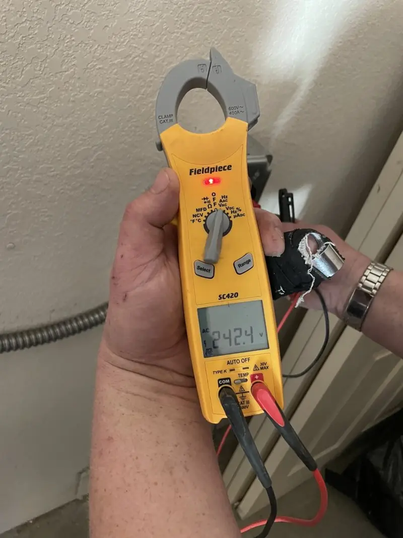 Voltage testing with clamp meter during Circuit Breaker Repair in Lake Mills